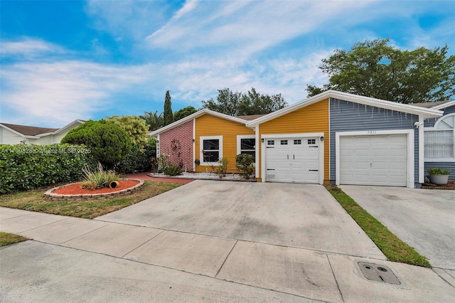 9821 W Fern Ln, Miramar, FL 33025 - view of front of house with an attached garage and concrete driveway
