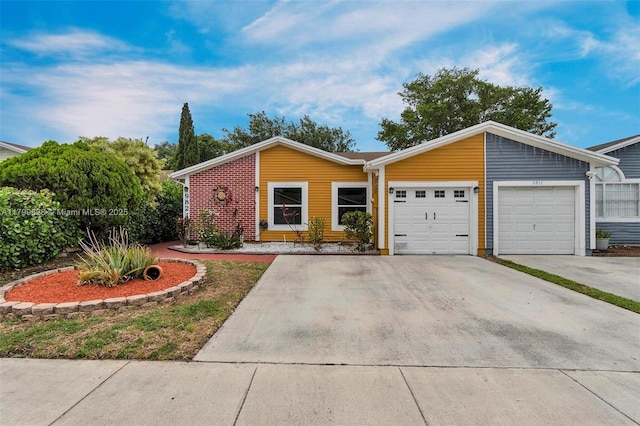 9821 W Fern Ln, Miramar, FL 33025 - view of front of property featuring a garage and driveway