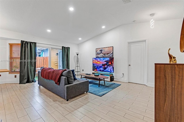 9821 W Fern Ln, Miramar, FL 33025 - living room featuring vaulted ceiling, baseboards, recessed lighting, and light wood-type flooring