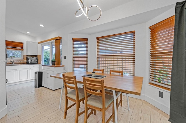 9821 W Fern Ln, Miramar, FL 33025 - dining area with light wood-type flooring, baseboards, a chandelier, and recessed lighting