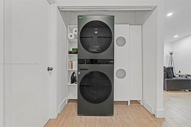 9821 W Fern Ln, Miramar, FL 33025 - washroom featuring stacked washer and clothes dryer and wood finished floors