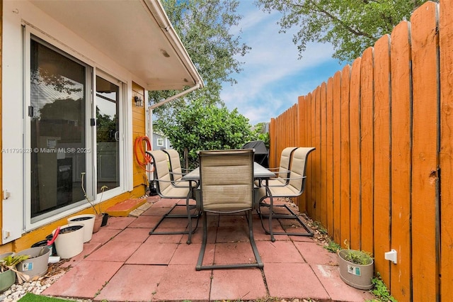 9821 W Fern Ln, Miramar, FL 33025 - view of patio with outdoor dining area and fence