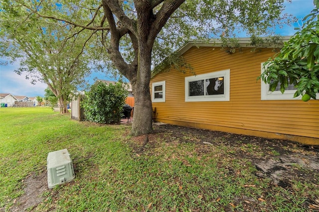 9821 W Fern Ln, Miramar, FL 33025 - view of side of home featuring a lawn
