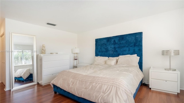 bedroom with wood finished floors