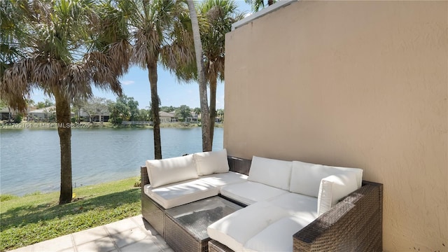 view of patio featuring outdoor lounge area and a water view