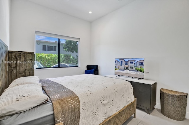 bedroom featuring light tile patterned floors