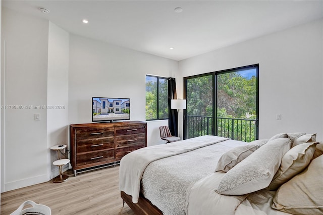 bedroom featuring access to outside, light wood-style floors, baseboards, and recessed lighting