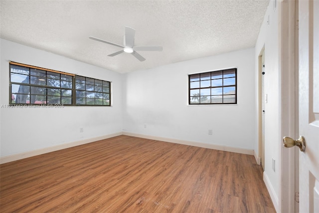 933 NE 199th St Unit 207, Miami, FL 33179 - empty room with a textured ceiling, a ceiling fan, wood finished floors, and baseboards