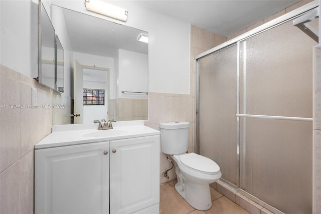 933 NE 199th St Unit 207, Miami, FL 33179 - bathroom featuring tile walls, tile patterned floors, a shower stall, toilet, and vanity