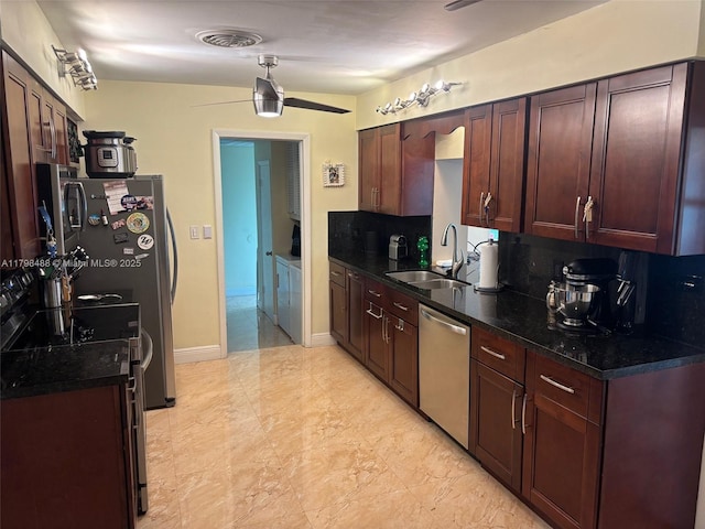 16195 SW 78th Ave, Palmetto Bay, FL 33157 - kitchen with appliances with stainless steel finishes, a ceiling fan, dark countertops, and dark brown cabinets