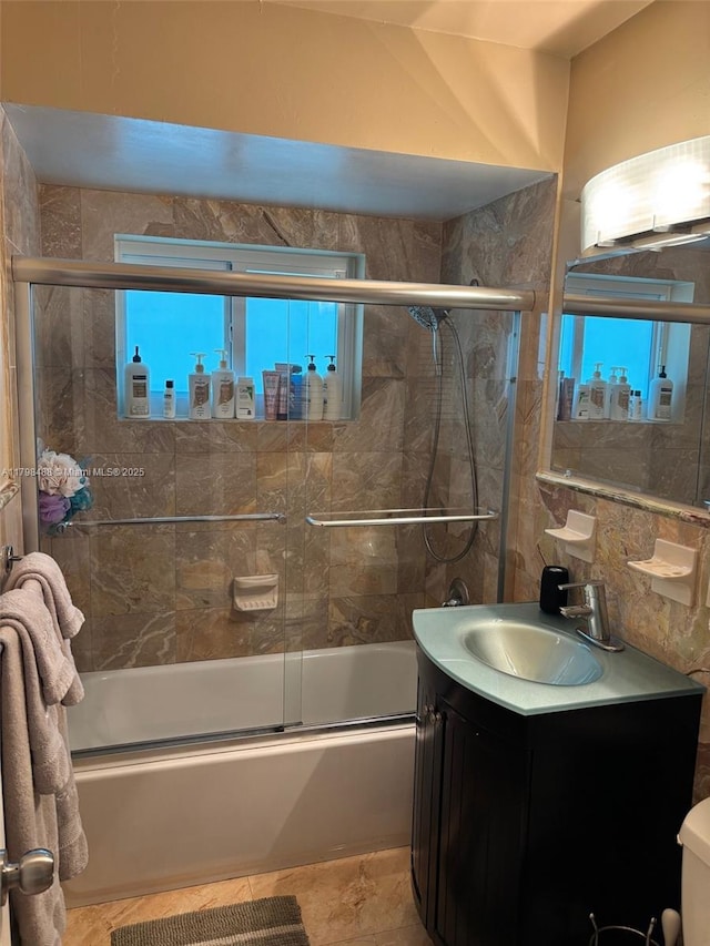16195 SW 78th Ave, Palmetto Bay, FL 33157 - bathroom with combined bath / shower with glass door, vanity, and tile walls