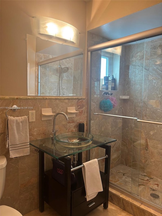 16195 SW 78th Ave, Palmetto Bay, FL 33157 - full bathroom featuring tile walls, a stall shower, vanity, and tile patterned floors