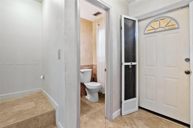 450 SE 7th St Unit 230, Dania Beach, FL 33004 - bathroom with toilet and tile patterned floors
