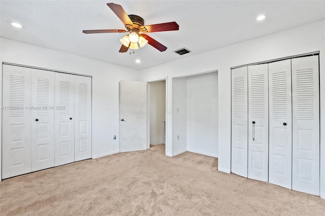 450 SE 7th St Unit 230, Dania Beach, FL 33004 - unfurnished bedroom featuring multiple closets, carpet, recessed lighting, baseboards, and a ceiling fan