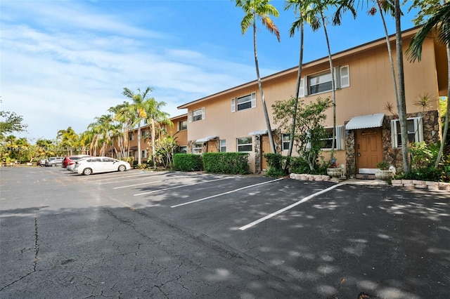 450 SE 7th St Unit 230, Dania Beach, FL 33004 - view of building exterior featuring uncovered parking