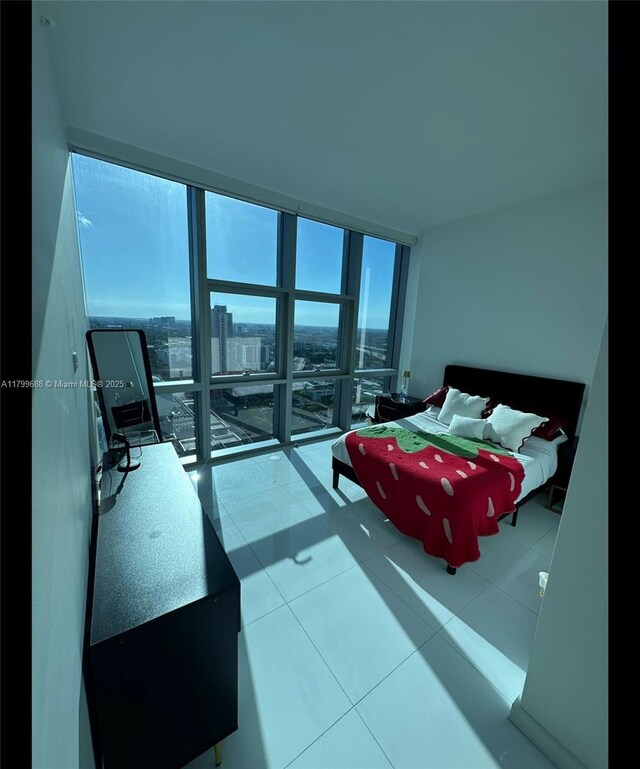 851 NE 1st Ave Unit 2208, Miami, FL 33132 - tiled bedroom featuring floor to ceiling windows and multiple windows