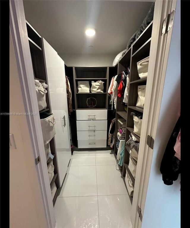851 NE 1st Ave Unit 2208, Miami, FL 33132 - walk in closet featuring light tile patterned floors