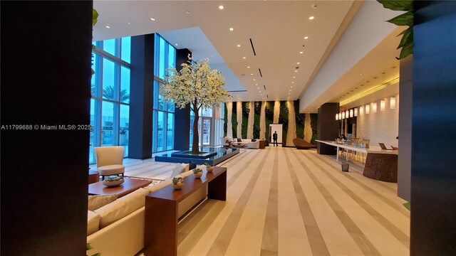 851 NE 1st Ave Unit 2208, Miami, FL 33132 - building lobby with floor to ceiling windows, recessed lighting, and a high ceiling