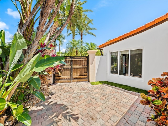 1730 NE 16th St, Fort Lauderdale, FL 33304 - view of patio featuring a gate