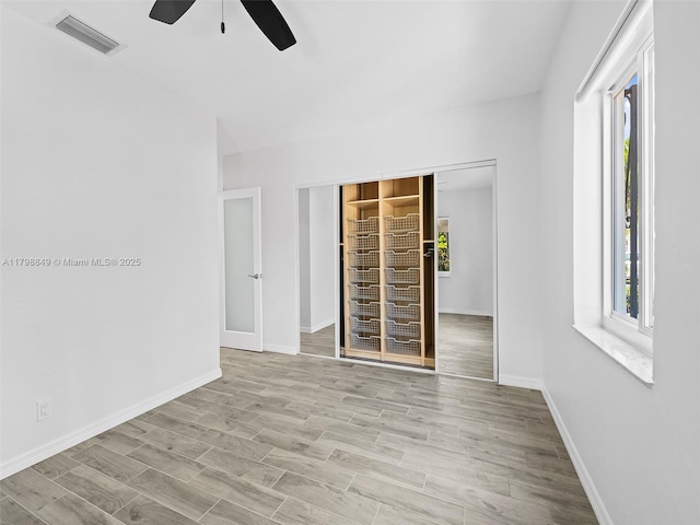 1730 NE 16th St, Fort Lauderdale, FL 33304 - empty room with a ceiling fan, baseboards, and wood finished floors