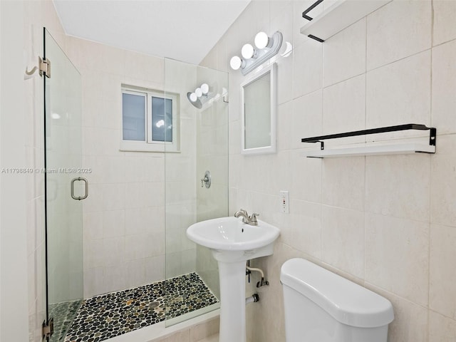 1730 NE 16th St, Fort Lauderdale, FL 33304 - bathroom with a shower stall, toilet, and tile walls