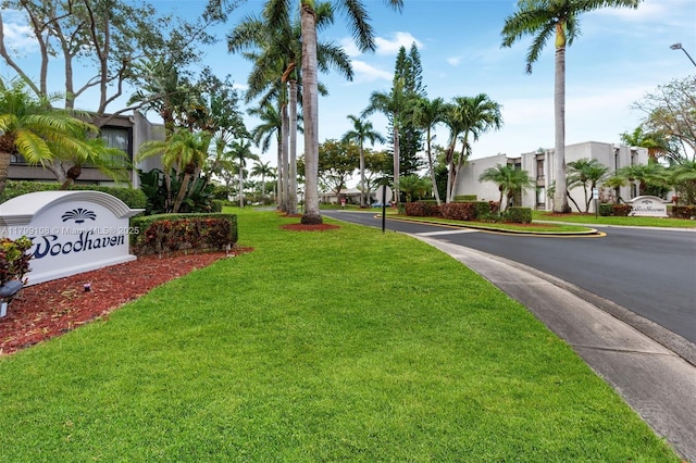 6668 Burning Wood Dr Unit 166, Boca Raton, FL 33433 - view of asphalt road with curbs, sidewalks, street lighting, and a residential view