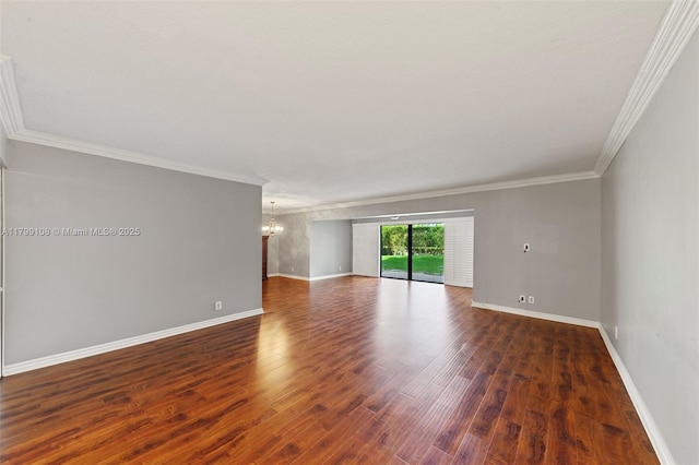 6668 Burning Wood Dr Unit 166, Boca Raton, FL 33433 - spare room featuring a chandelier, crown molding, wood finished floors, and baseboards