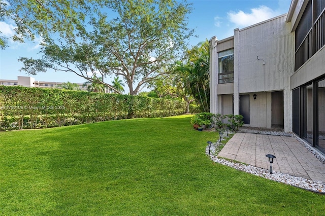 6668 Burning Wood Dr Unit 166, Boca Raton, FL 33433 - view of grassy yard with a patio area