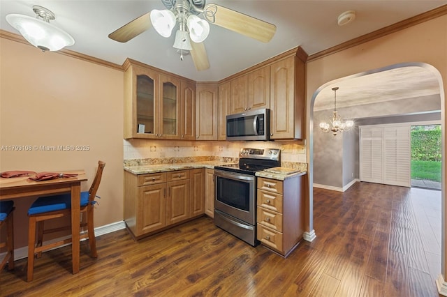 6668 Burning Wood Dr Unit 166, Boca Raton, FL 33433 - kitchen with appliances with stainless steel finishes, arched walkways, light stone counters, ornamental molding, and backsplash