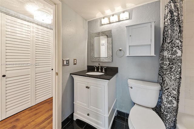 6668 Burning Wood Dr Unit 166, Boca Raton, FL 33433 - full bathroom with toilet, vanity, a shower with curtain, a textured wall, and baseboards