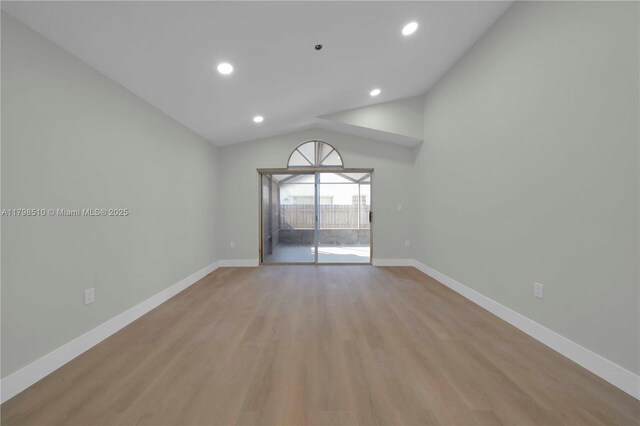 20076 NW 85th Ave, Hialeah, FL 33015 - unfurnished room with baseboards, vaulted ceiling, light wood-style flooring, and recessed lighting
