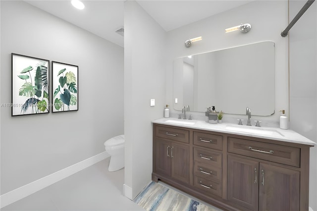 20076 NW 85th Ave, Hialeah, FL 33015 - bathroom featuring toilet, double vanity, and baseboards