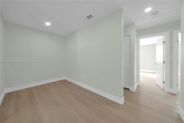 20076 NW 85th Ave, Hialeah, FL 33015 - unfurnished room featuring light wood-style floors, baseboards, and recessed lighting