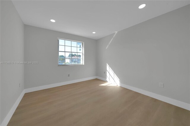 20076 NW 85th Ave, Hialeah, FL 33015 - empty room with wood finished floors, baseboards, and recessed lighting
