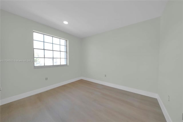 20076 NW 85th Ave, Hialeah, FL 33015 - unfurnished room with wood finished floors, baseboards, and recessed lighting