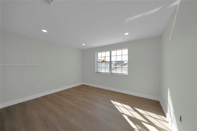20076 NW 85th Ave, Hialeah, FL 33015 - empty room featuring wood finished floors, baseboards, and recessed lighting