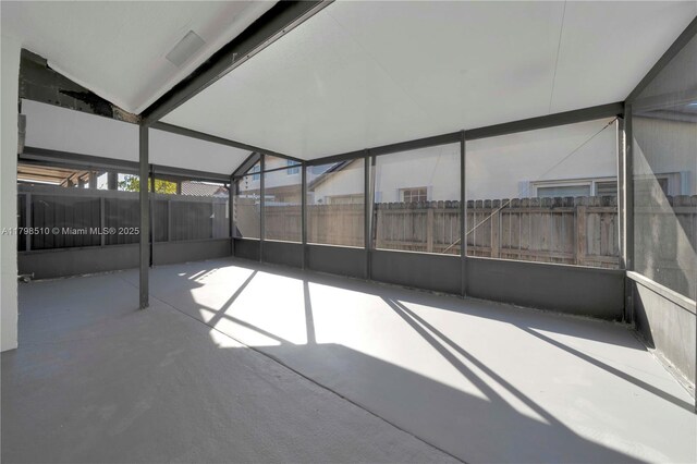 20076 NW 85th Ave, Hialeah, FL 33015 - unfurnished sunroom with lofted ceiling