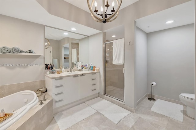 bathroom featuring a shower stall, a chandelier, vanity, a whirlpool tub, and toilet