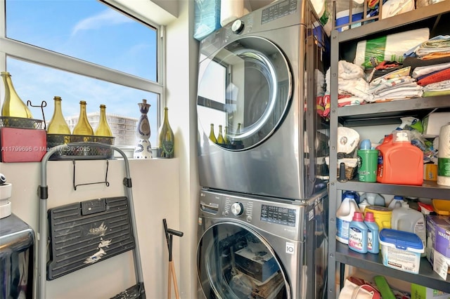 laundry room with stacked washer / dryer