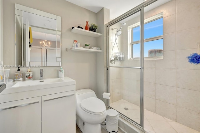 full bath with a shower stall, toilet, a chandelier, and vanity