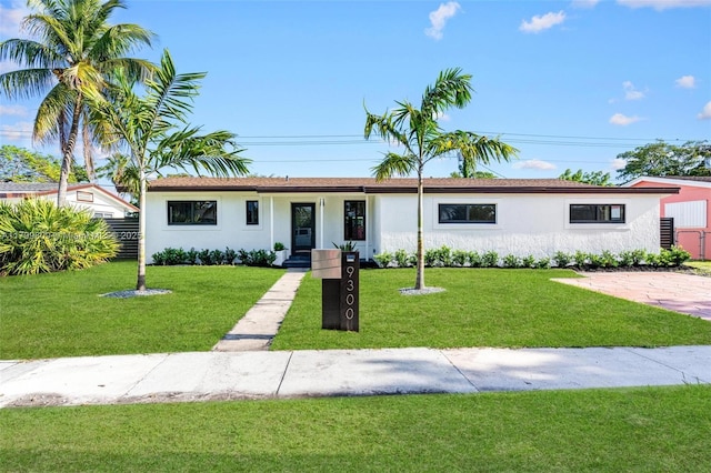 9300 Marine Dr, Cutler Bay, FL 33189 - ranch-style home with stucco siding and a front lawn