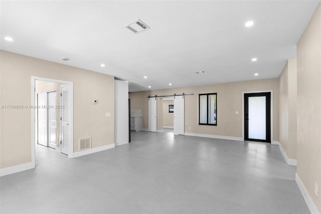 9300 Marine Dr, Cutler Bay, FL 33189 - unfurnished room with a barn door, recessed lighting, baseboards, and finished concrete flooring