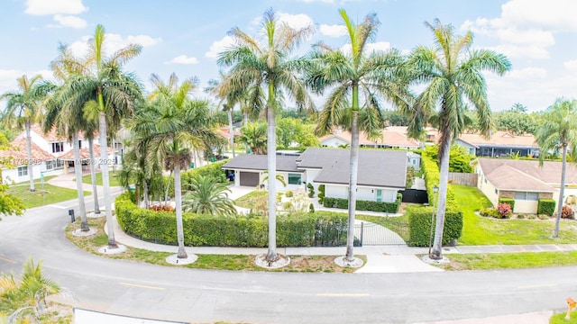 7345 N Oakmont Dr, Hialeah, FL 33015 - view of front of home with a residential view and a gate