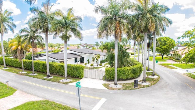 7345 N Oakmont Dr, Hialeah, FL 33015 - view of front of house featuring a gate and a residential view