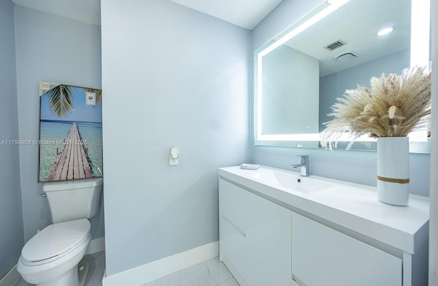 7345 N Oakmont Dr, Hialeah, FL 33015 - bathroom with baseboards, vanity, toilet, and marble look tile flooring