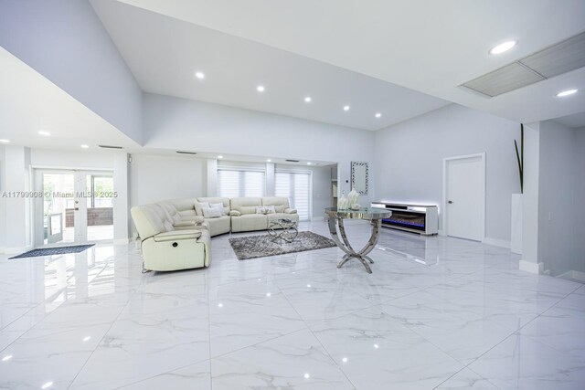 7345 N Oakmont Dr, Hialeah, FL 33015 - living room with light marble finish flooring, recessed lighting, french doors, baseboards, and a towering ceiling