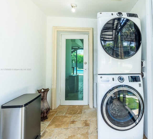 7345 N Oakmont Dr, Hialeah, FL 33015 - washroom featuring estacked washer and dryer and stone tile flooring