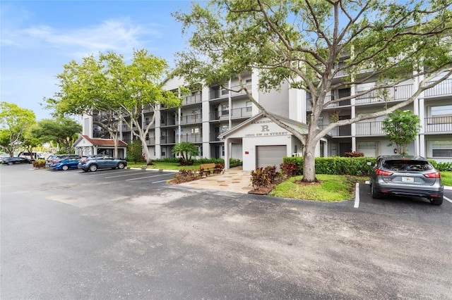 12501 SW 14th St Unit 108R, Pembroke Pines, FL 33027 - view of apartment building / complex featuring uncovered parking