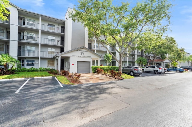 12501 SW 14th St Unit 108R, Pembroke Pines, FL 33027 - view of apartment building / complex with uncovered parking
