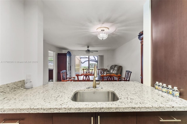 12501 SW 14th St Unit 108R, Pembroke Pines, FL 33027 - kitchen with a sink, ceiling fan, light stone countertops, and open floor plan
